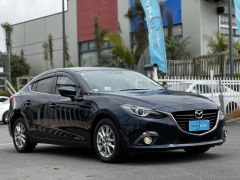 Photo of the vehicle Mazda Axela