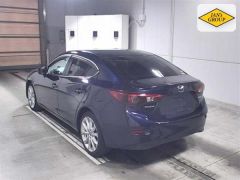 Photo of the vehicle Mazda Axela